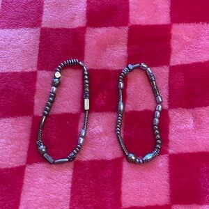 Set of two starchy silver colored bracelets